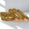 MANKAIROOP Women Pack of 6 Brass High Gold Bangles with Ruby & Green Stones
